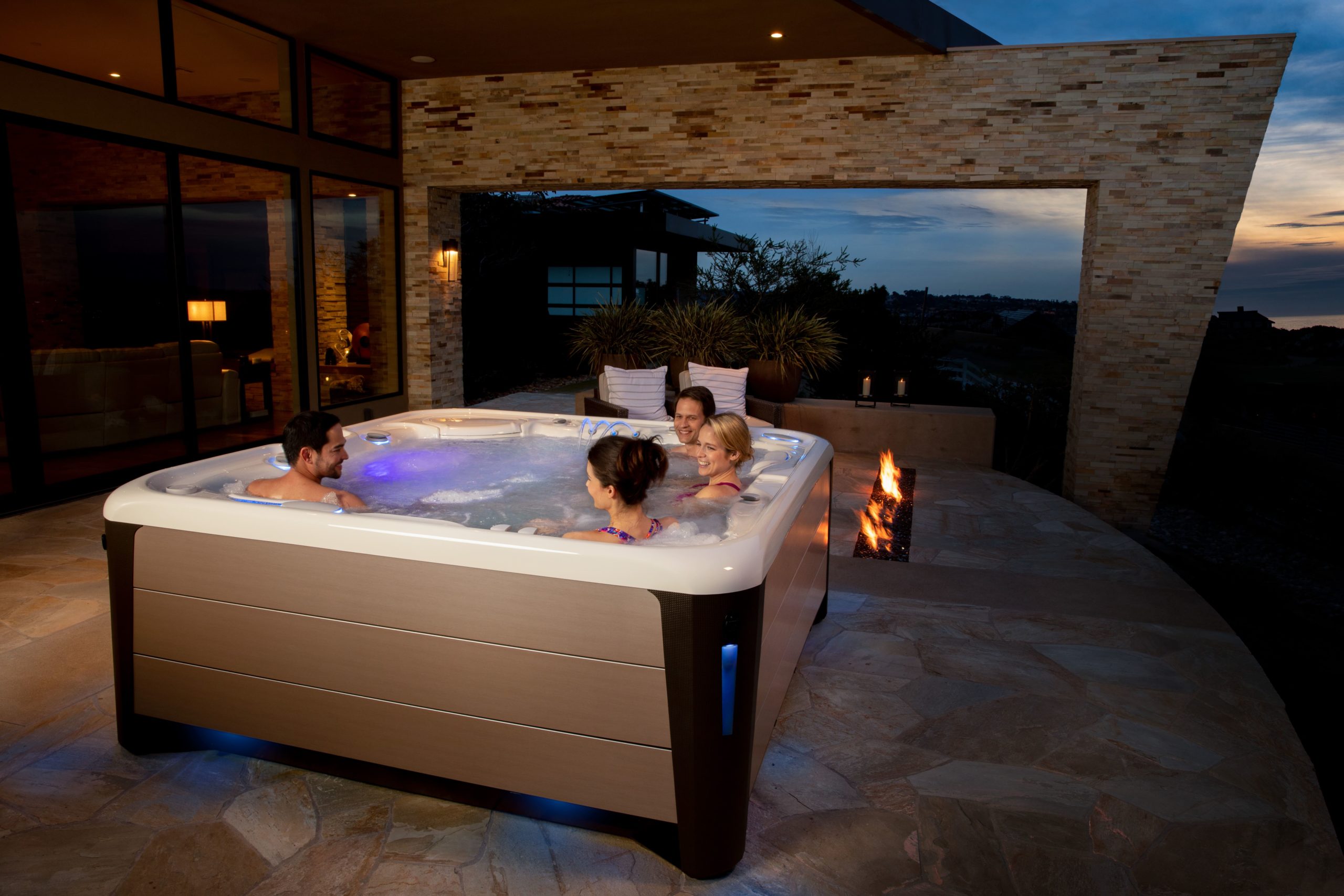 A hot tub enclosure can be a simple roof over your spa or an exterior room that allows you to use your hot tub in even the worst weather.