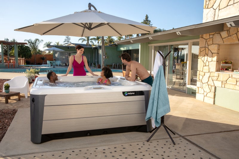 For shade and portability, a spa side umbrella is better than temporary hot tub enclosures.