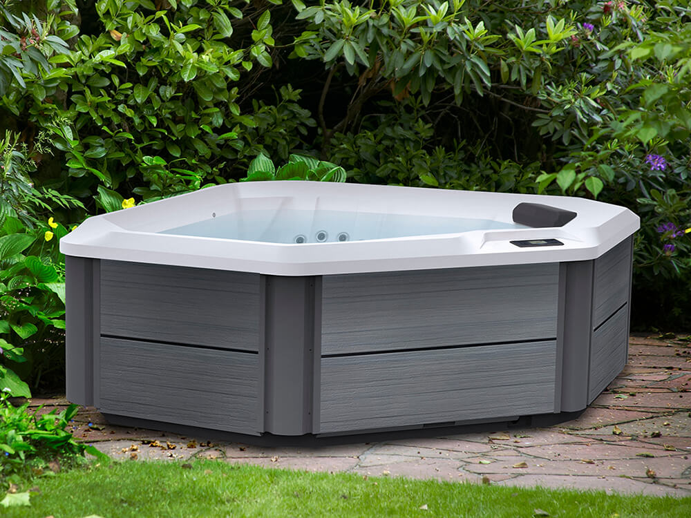 couple enjoying an evening infront of Jetsetter Hot Tub.