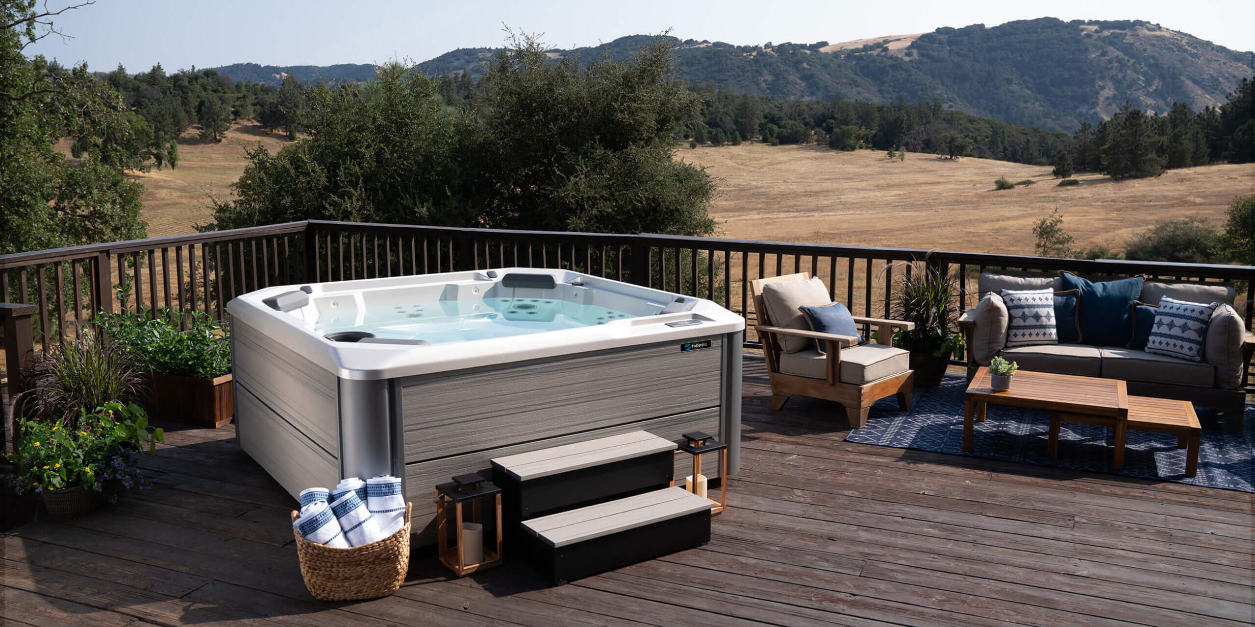 https://www.hotspring.com/wp-content/uploads/2022/03/hot-spring-spas-hot-spot-collection-page-cspot-lifestyle-spa-empty-with-accessories-1-scaled-1.jpg