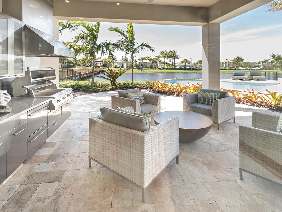 Functional outdoor living space with outdoor kitchen and dining area.