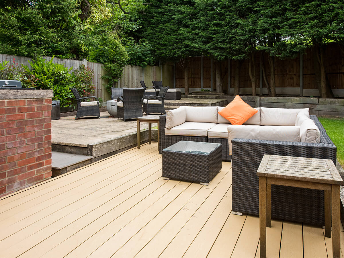 Outdoor backyard designated living area with comfortable seating.